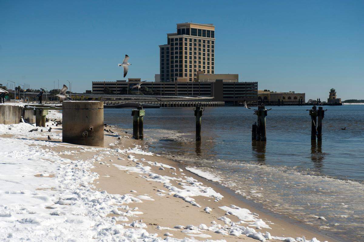 Snow remains on the beach near the Beau Rivage Resort and Casino in Biloxi the day after more than 5 inches and more fell across South Mississippi Jan. 21. Some of the 12 Coast casinos closed during the storm and others had limited restaurant and venue hours.