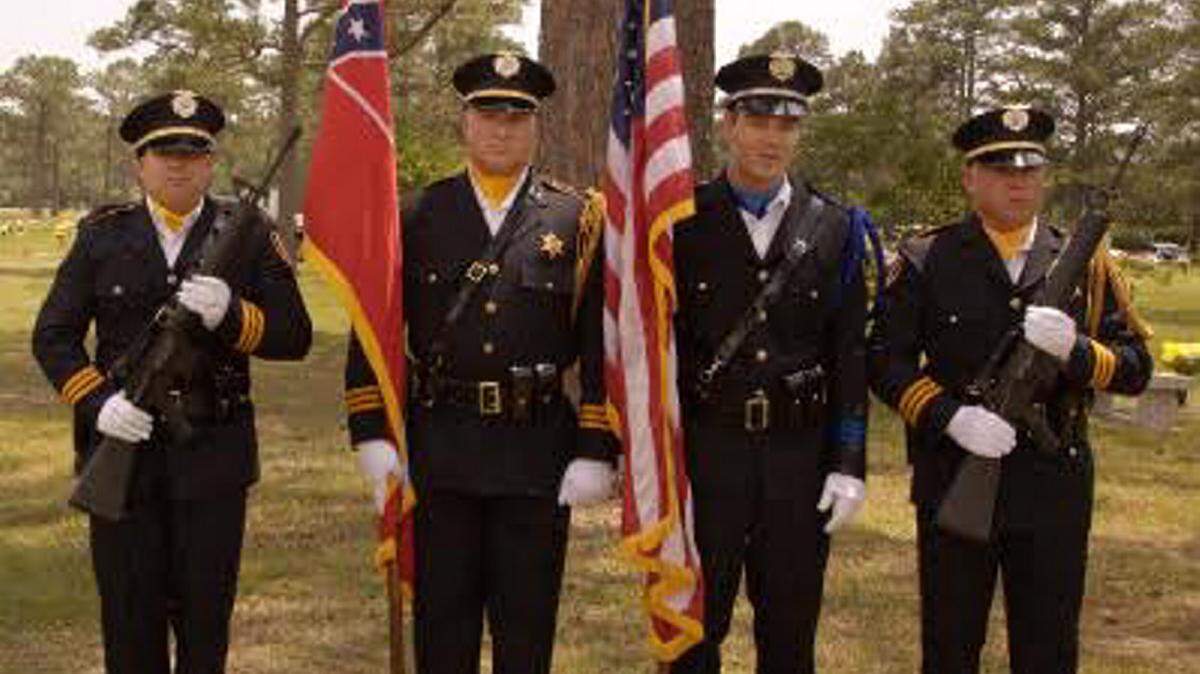 PHOTO COURTESY OF THE JACKSON COUNTY SHERIFF'S DEPARTMENT The Jackson County Color Guard led to the procession to the gravesite of Pascagoula Police Officer Nathaniel Smith at Crestlawn Memorial Park on Thursday.
