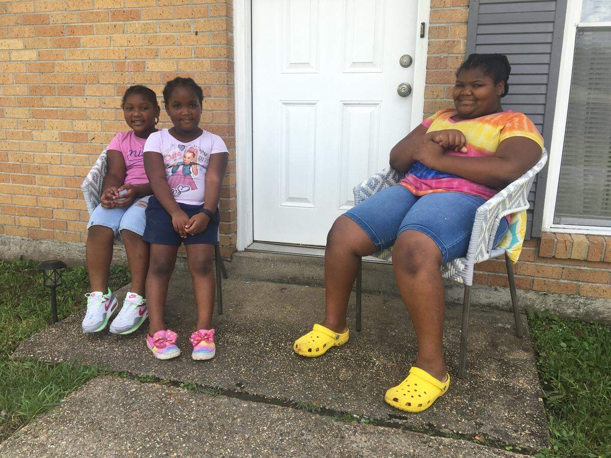 Sisters Bailey, 6, Zoey, 5, and London, 10, had to stay home from school on Tuesday, Aug. 31, 2021, because the roads in their North Gulfport subdivision were flooded.