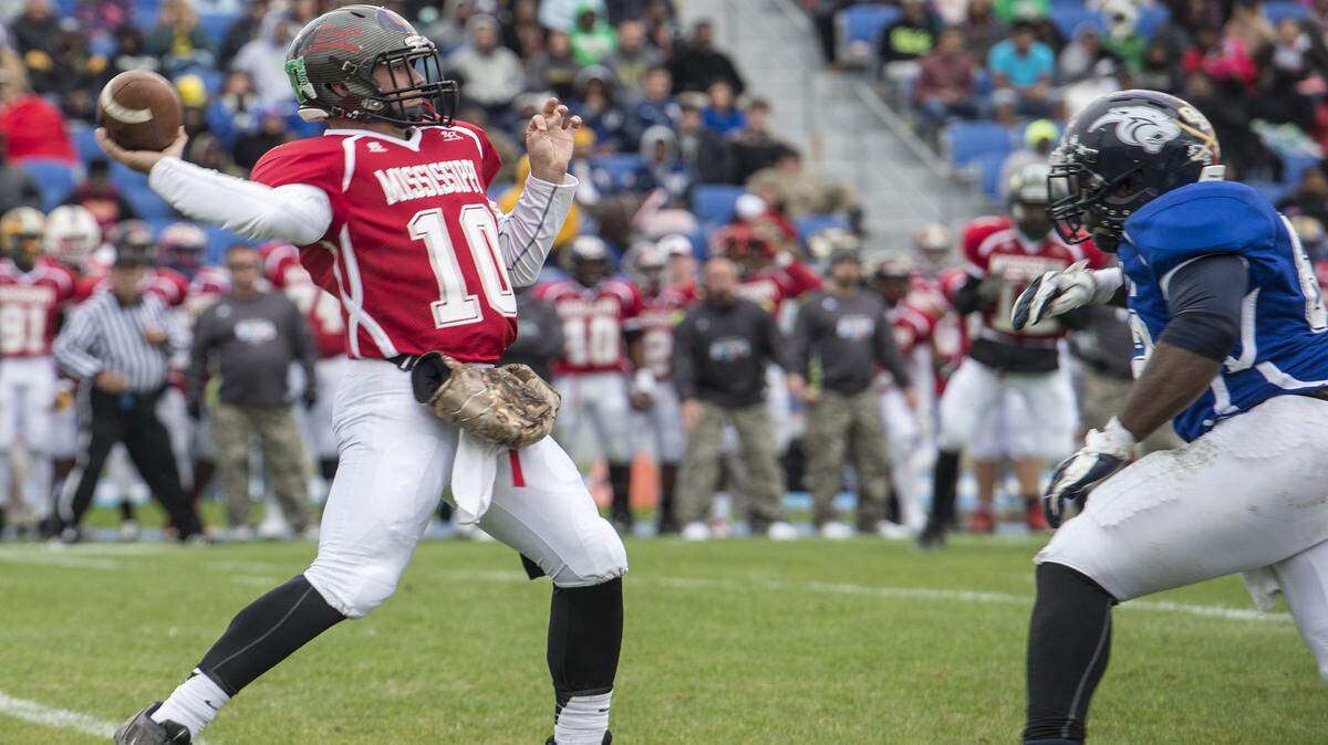 WILLIAM COLGIN/SPECIAL TO THE SUN HERALD 
 North All-Star, Gardner Minshew from Brandon, goes back for a pass during the 2014-2015 Bernard Blackwell All-Star Football game in Gulfport on Saturday. Earlier this month, Minshew led Northwest Community College to a national championship and Mississippi Bowl victory.