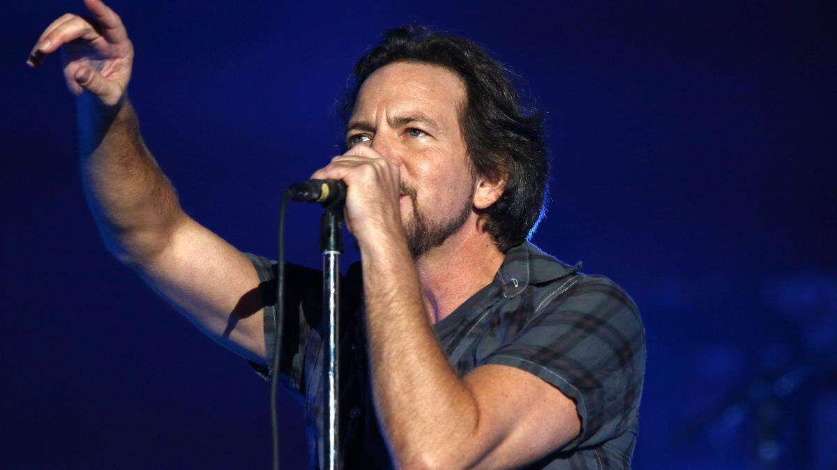 FILE - In this Sept. 26, 2015, file photo, Eddie Vedder, of Pearl Jam, performs at the Global Citizen Festival in Central Park in New York. Rock bands Pearl Jam and Boston are canceling shows in North Carolina over the state's new law on LGBT rights. In a statement issued Monday, April 18, 2016, on the band's website, Pearl Jam called the law "a despicable piece of legislation that encourages discrimination against an entire group of American citizens." (Photo by Greg Allen/Invision/AP, File)
