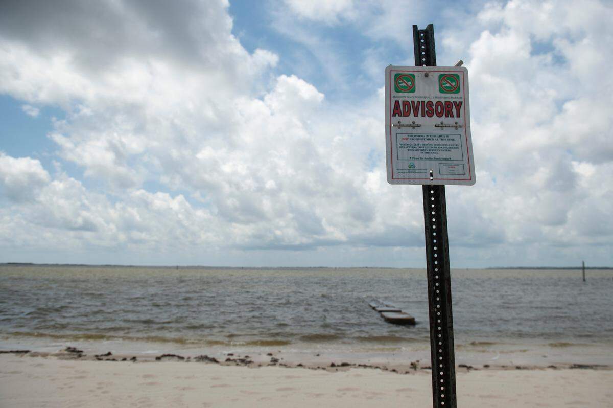 A sign on East Beach in Ocean Springs on Wednesday, April 30, 2025, warns of a water contact advisory. The Mississippi Department of Environmental Quality tests the water on the beaches multiple times a week and issues advisories for high bacteria levels.