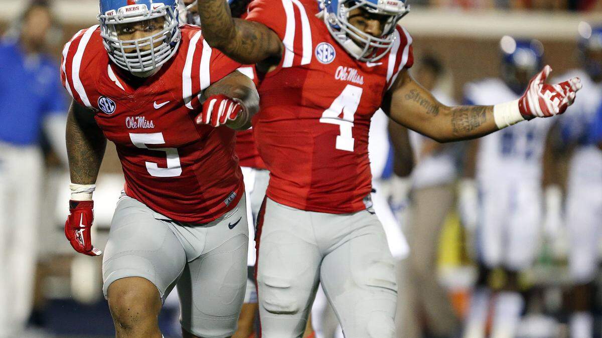 ROGELIO V. SOLIS/ASSOCIATED PRESS 
 Ole Miss defensive tackle Robert Nkemdiche (5) and linebacker Denzel Nkemdiche (4), his brother, celebrate Memphis quarterback Paxton Lynch fumble last year. Denzel Nkemdiche is in the hospital, according to RebelGrove.com and the Clarion Ledger.