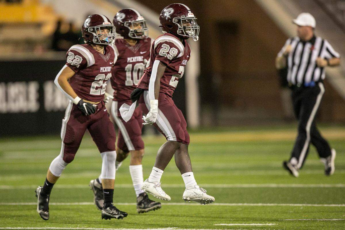 Picayune’s Amarion Tyson, right, celebrates after the 5A State Championship game at M.M. Roberts Stadium in Hattiesburg on Saturday, Dec. 4, 2021.