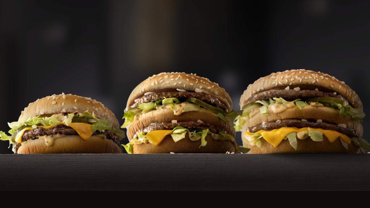 This photo provided by McDonald's shows, from left to right: McDonald's Mac Jr., Big Mac and Grand Mac. McDonald's is testing bigger and smaller versions of its Big Mac as the world's biggest hamburger chain pushes to revive its business. The company says it's testing the Grand Mac and Mac Jr. in the Central Ohio and the Dallas areas, and will see how they do before deciding on a national rollout. (McDonald's via AP)