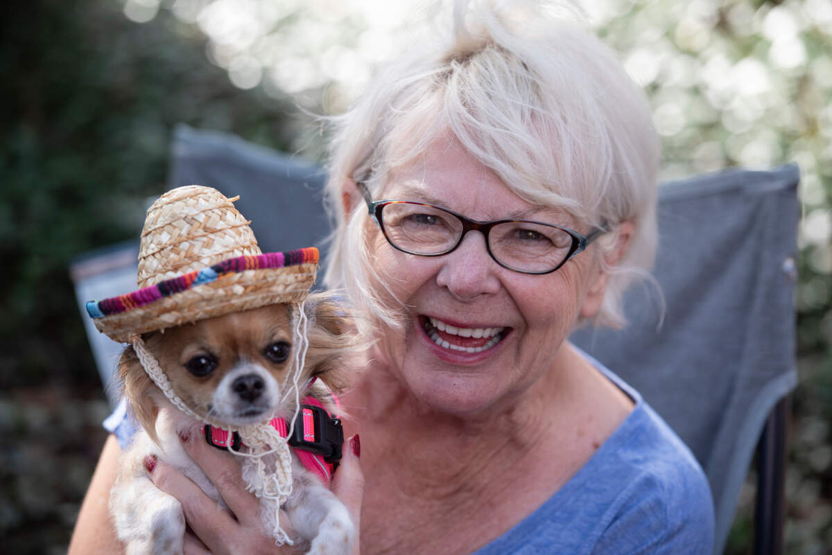 Jolene and her dog Mia during the Ocean Springs Elks Club Mardi Gras Parade in Ocean Springs on Saturday, Feb. 15, 2025.
