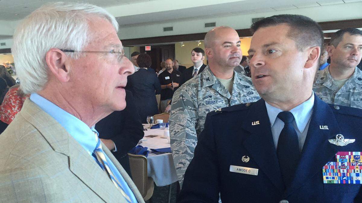 PAUL HAMPTON/SUN HERALD 
 Sen. Roger Wicker talks to Air Force Col. Frank Amodeo on Wednesday at the Gulport Chamber of Commerce Military Affairs Breakfast.
