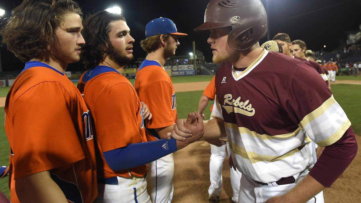 CHRIS TODD/SPECIAL TO THE SUN HERALD 
 George County's Walker Robbins (right) congratulates Madison Central winning pitcher Justin Milam on Thursday, May 19, 2016, in the MHSAA State Baseball Championships at Trustmark Park in Pearl, Miss.