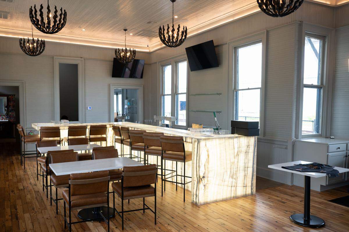 The onyx bar glows in the main dining room at Chandeleur Depot Brewpub in Pascagoula.