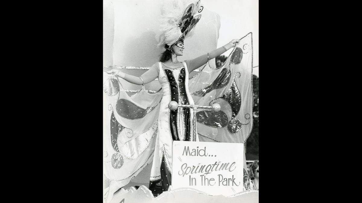maid wears a “springtime in the park” costume in 1985 at the Waveland Mardi Gras parade.