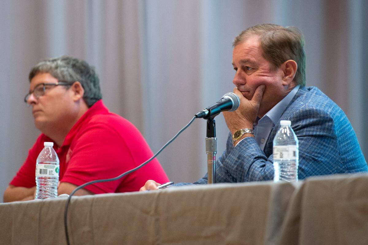 Ocean Springs Mayor Kenny Holloway, right, listens as residents voice their concerns about a proposed Urban Renewal Plan during a public hearing hosted by the Board of Aldermen at the Ocean Springs Civic Center on Monday, Oct. 2, 2023.