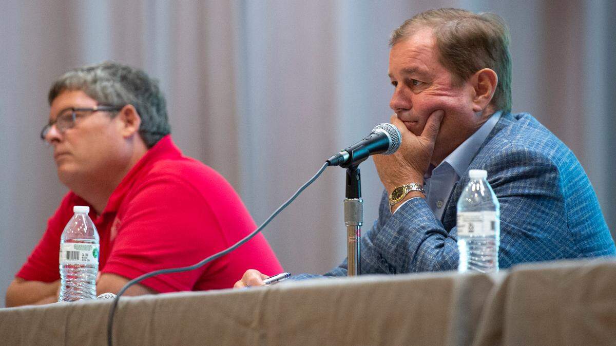 Ocean Springs Mayor Kenny Holloway, right, listens as residents voice their concerns about a proposed Urban Renewal Plan during a public hearing hosted by the Mayor and Board of Aldermen at the Ocean Springs Civic Center on Oct. 2, 2023.