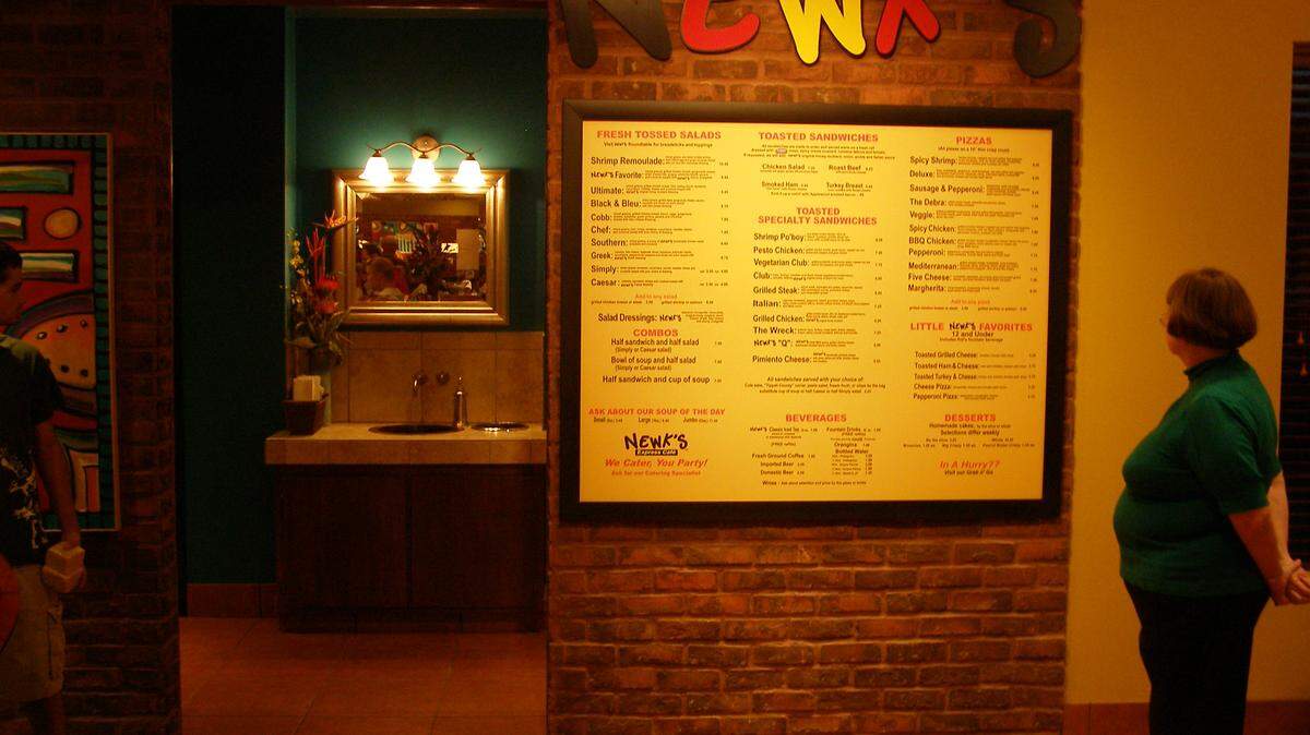 Scott Hawkins/Sun Herald 
 A customer checks out the menu inside Newk's Express Cafe in the Promenade Shopping Center in D'Iberville. The company, based in Jackson, has won an award for its online employee training site.
