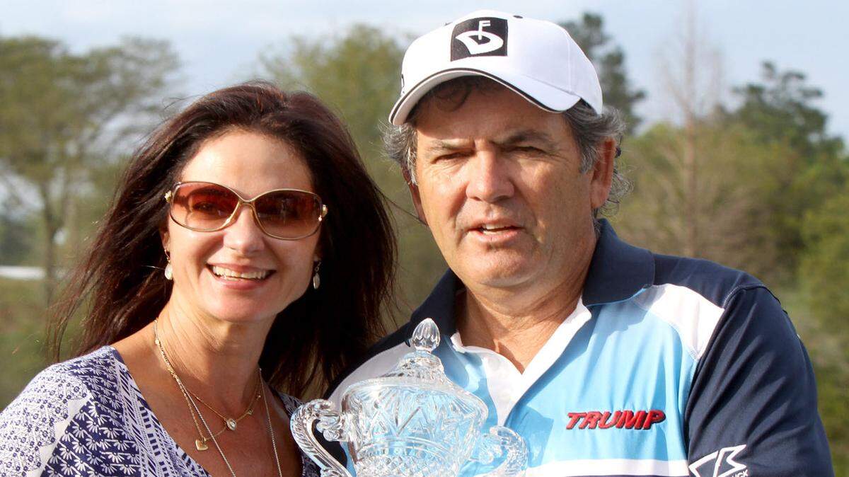 TIM ISBELL/SUN HERALD 
 David Frost poses with his wife, Colleen Frost, and his newest trophy after winning the Mississippi Gulf Resort Classic, March 29, 2015. Frost will be back to defend his MGRC championship next month.