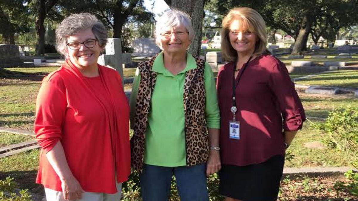 JEFF CLARK/SPECIAL TO THE SUN HERALDLive Oak Cemetery Historian Becky Orfila, left, and Live Oak Cemetery Association Director Alice Russell of Live Oak Cemetery in Pass Christian discuss the upcoming 'Living History Tour' with Pass Christian Middle School teacher Lori Fisher, right, at Live Oak Cemetery in Pass Christian. The free tours will be held tonight and Saturday beginning at 5 p.m.