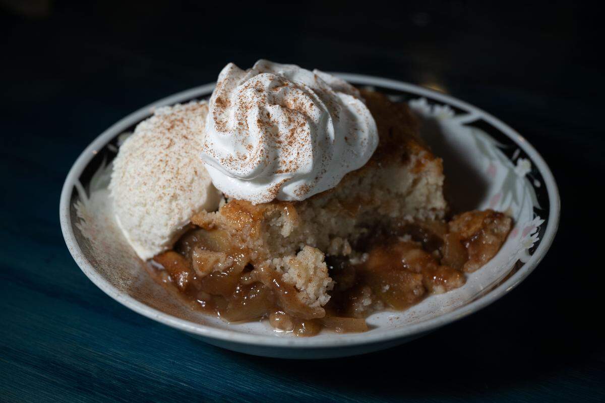 Apple cobbler with homemade ice cream is a seasonal dessert at the Boonies on the Bayou in Bay St. Louis on Friday, Dec. 5, 2025.
