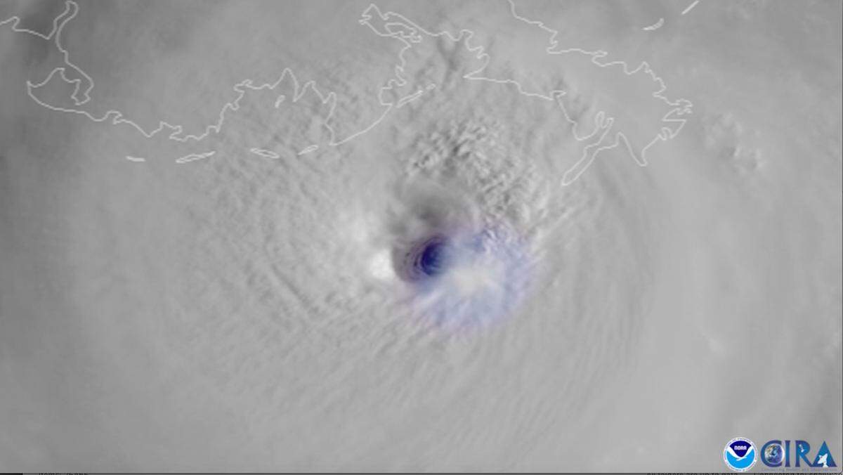 This satellite image provided by the National Oceanic and Atmospheric Administration, captured by NOAA’s GOES-16, shows lightning swirling around the eye of Hurricane Ida as the storm approaches the Louisiana coast on Aug. 29, 2021.