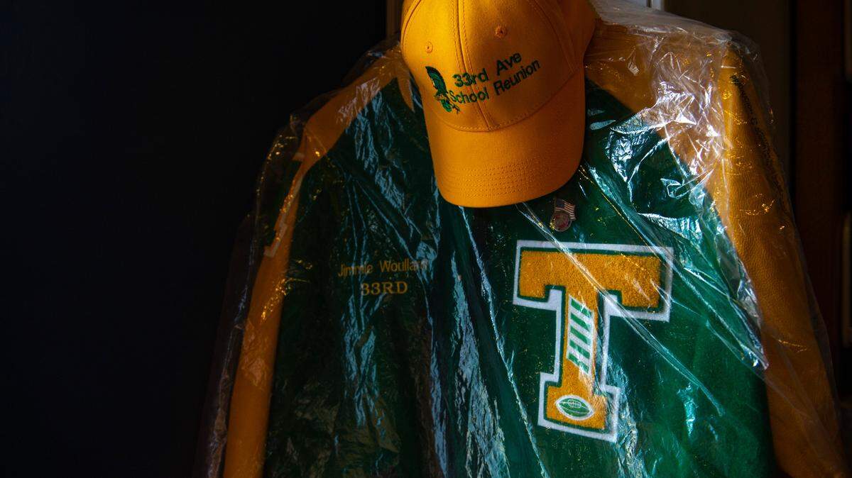 The letterman jacket of 33rd Ave. School alumnus Jimmie Woullard hangs in the East Biloxi Library on Saturday, July 31, 2021. Photos and objects from the 33rd Ave. School are being collected at the library for an exhibit.