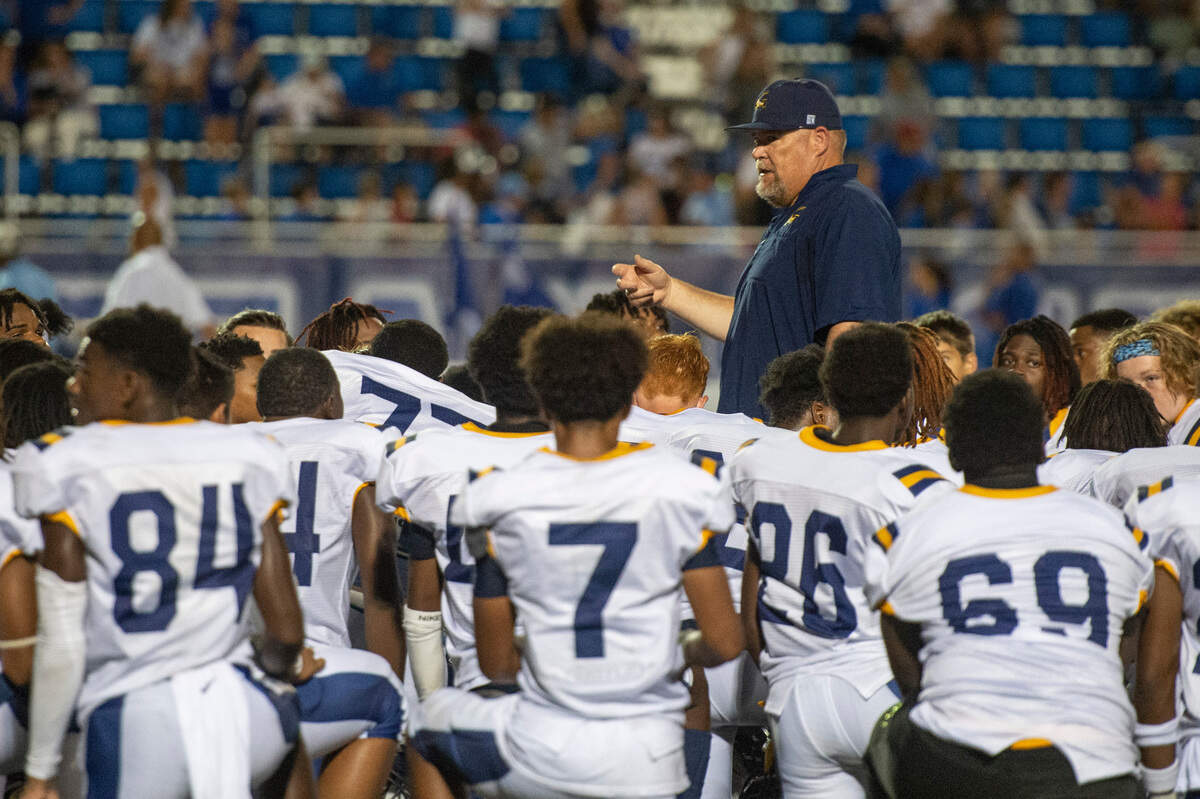 Gautier Gators head coach Marcus High speaks to his players after a Jamboree game against Ocean Springs on Friday, Aug. 19, 2022.