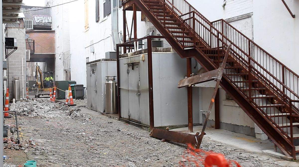 AMANDA McCOY/SUN HERALDConstruction on Gulfport's Fishbone Alley started in early January, but had to be stopped Jan. 21 for utility work. Contractor Gulf Breeze Landscaping of Gautier is expected to be back on the job next week.