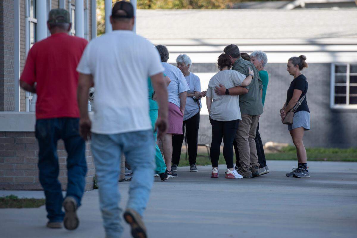 Family members of James Ray Saucier embrace outside the Pearl River County Courthouse Annex in Poplarville on Tuesday, Dec. 17, 2024, where Saucier was shot.