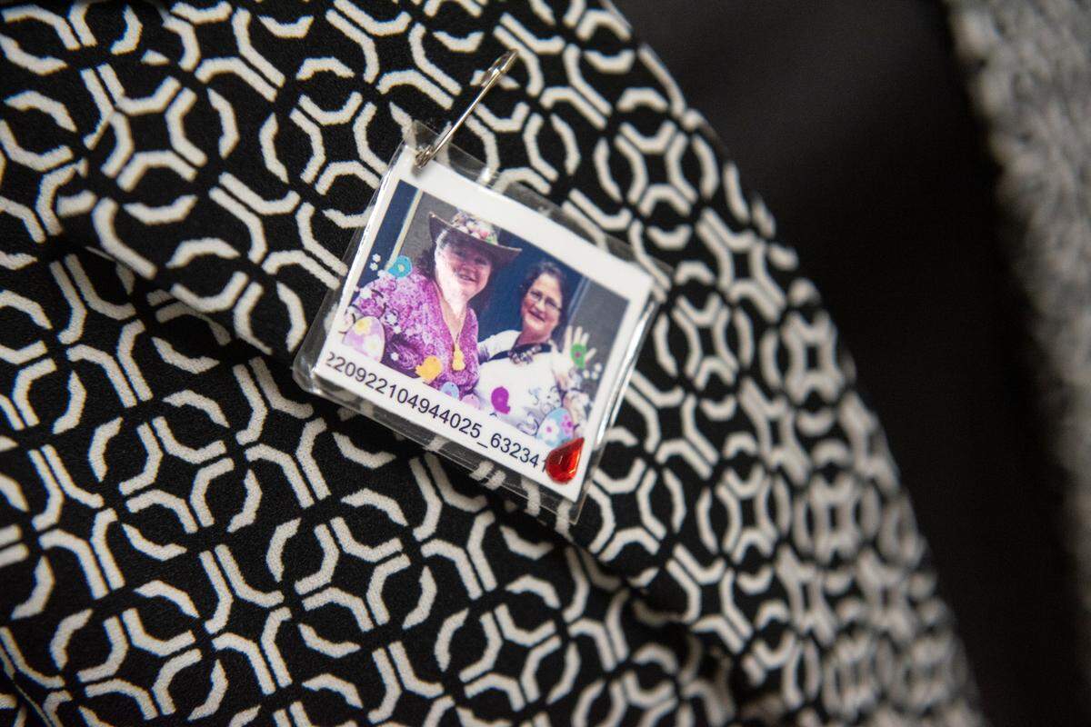 Mary “Julie” Kelley and Elizabeth “Lisa” Kelley Conners’s sister-in-law Leslie Kelley wears a photo of Julie and Lisa on her lapel during Joesph Nangle’s sentencing in their deaths in Jackson County Circuit Court on Tuesday, Oct. 22, 2024.