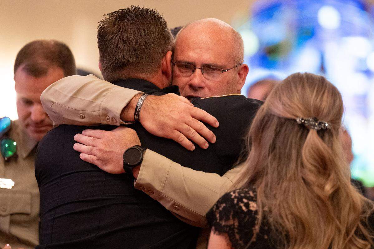 Funeral attendees give their condolences to friends and family of Michael Jimerson.