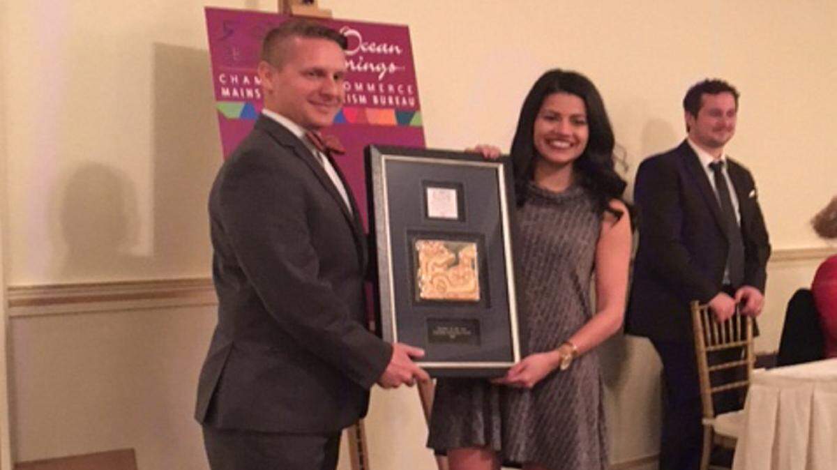 OS CHAMBEROcean Springs Chamber and Main Street Past president Chad Wade, left, with Brandin Brosch with Charisma, A Girls Best Outfit boutique, winner of the chamber's Retailer of the Year award on Thursday.