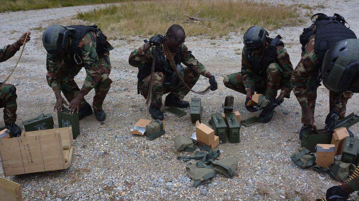 International security force professionals from Cameroon, Chad and Niger prepare ammunition prior to participating in immediate action drills in the Naval Small Craft Instruction and Technical Training School’s Patrol Craft Officer - Coastal course in support of the second annual Lake Chad Basin Initiative at facilities located on the John C. Stennis Space Center in Mississippi.