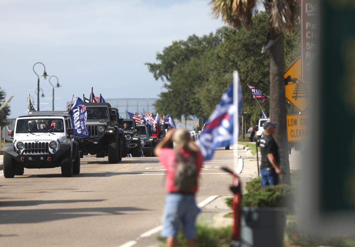 Spectators watched as hundreds of people participated in a Jeep parade supporting President Donald Trump in Bay St. Louis, Mississippi, on Saturday, Sept. 12, 2020.