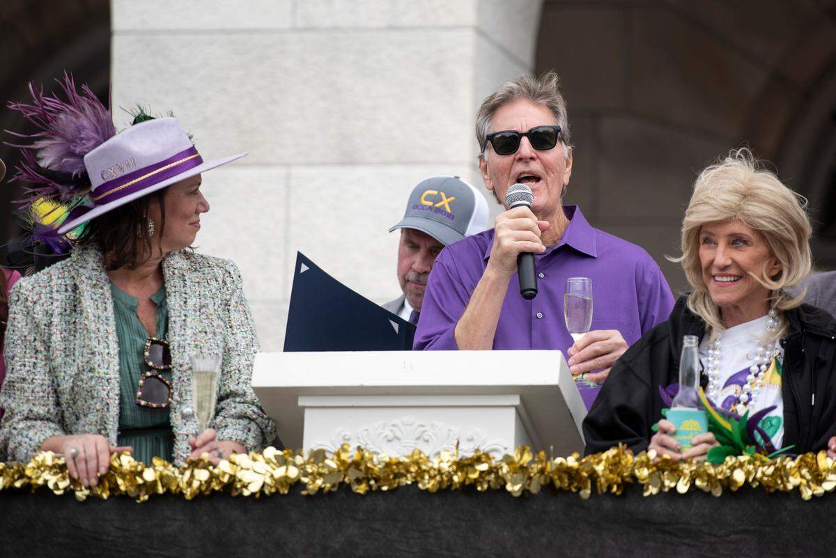 Biloxi Mayor Andrew “FoFo” Gilich gives a toast during the Gulf Coast Carnival Association Mardi Gras parade in Biloxi on Tuesday, March 4, 2025.
