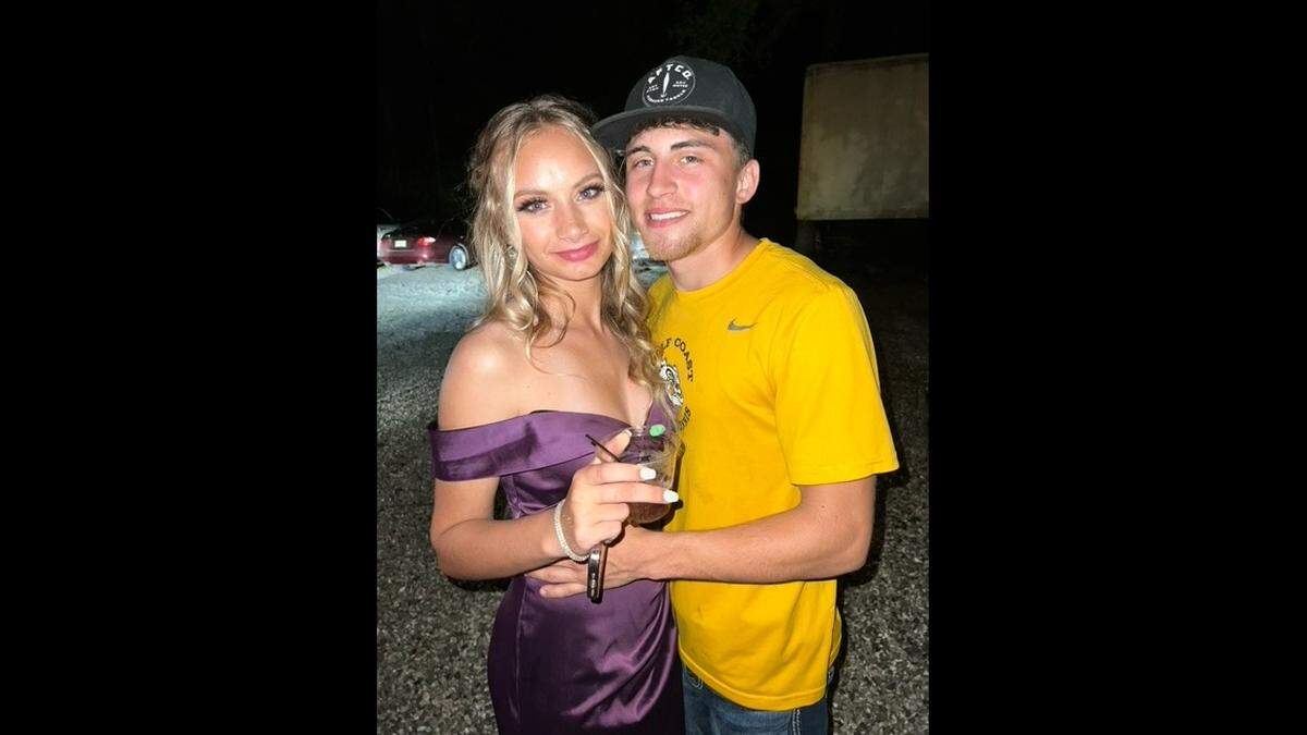 Aydin Stallings, 18, pictured with his girlfriend, Shyla Allen, in a picture a friend shot of couple a night before Stallings drowned in a pond at a dirt pit in the Kiln.