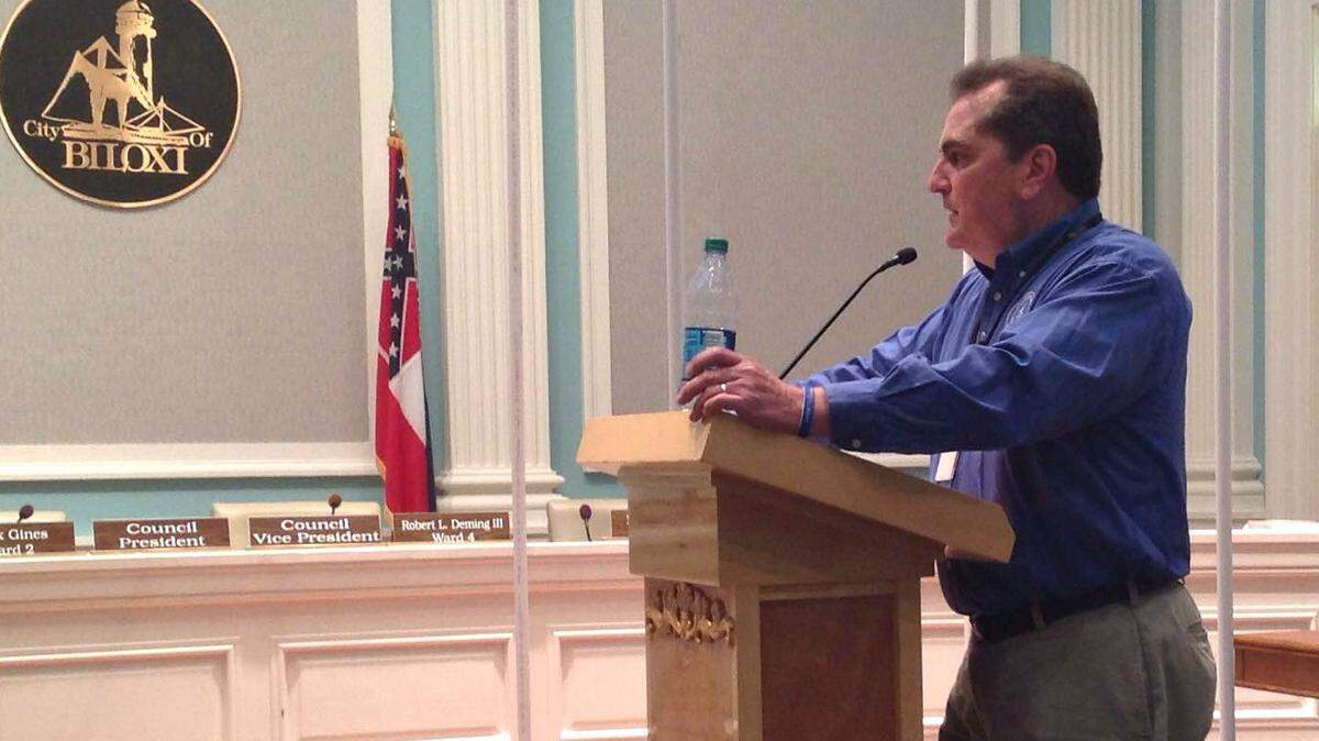 MARY PEREZ/SUN HERALD 
 Biloxi Public Works Director Dan Gaillet uses PVC pipe to illustrate the average water useage of residents. Rates are not keeping up with the expenses of operating the water and sewer departments, he told the council, and he proposed three rate increase scenarios.
