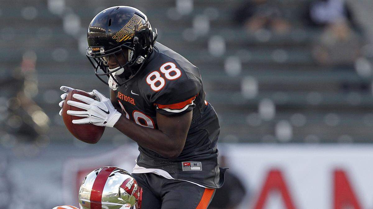 National team wide receiver Mike Thomas (88), of Southern Mississippi, catches a pass against American team cornerback Prince Charles Iworah (30), of Western Kentucky, during the first half of the NFLPA Collegiate Bowl football game in Carson, Calif., Saturday, Jan. 23, 2016. (AP Photo/Alex Gallardo)
