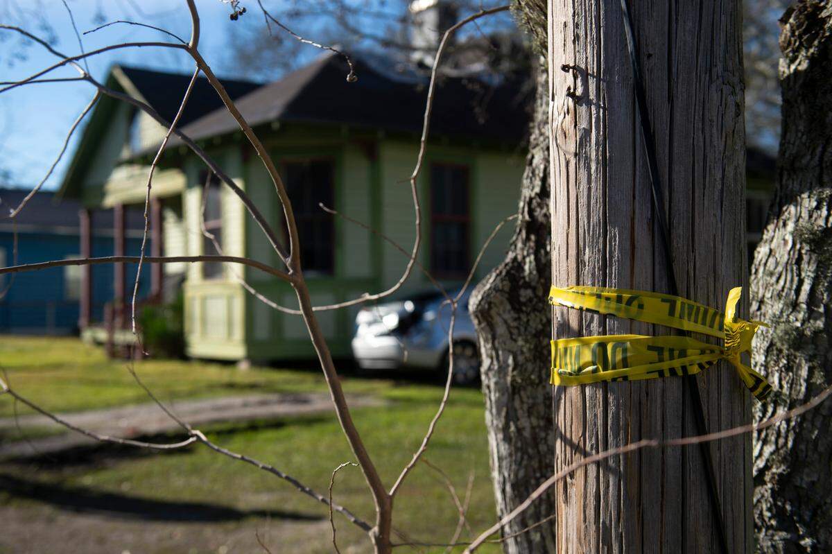 Crime scene tape is wrapped around a pole outside of the home of Harold Payne, 85, and Jittaun Payne, 71, in Pascagoula on Thursday, March 6, 2025. The Paynes were killed on Wednesday when their son Darold Sim Payne, 39, allegedly beat them to death with a cinderblock.