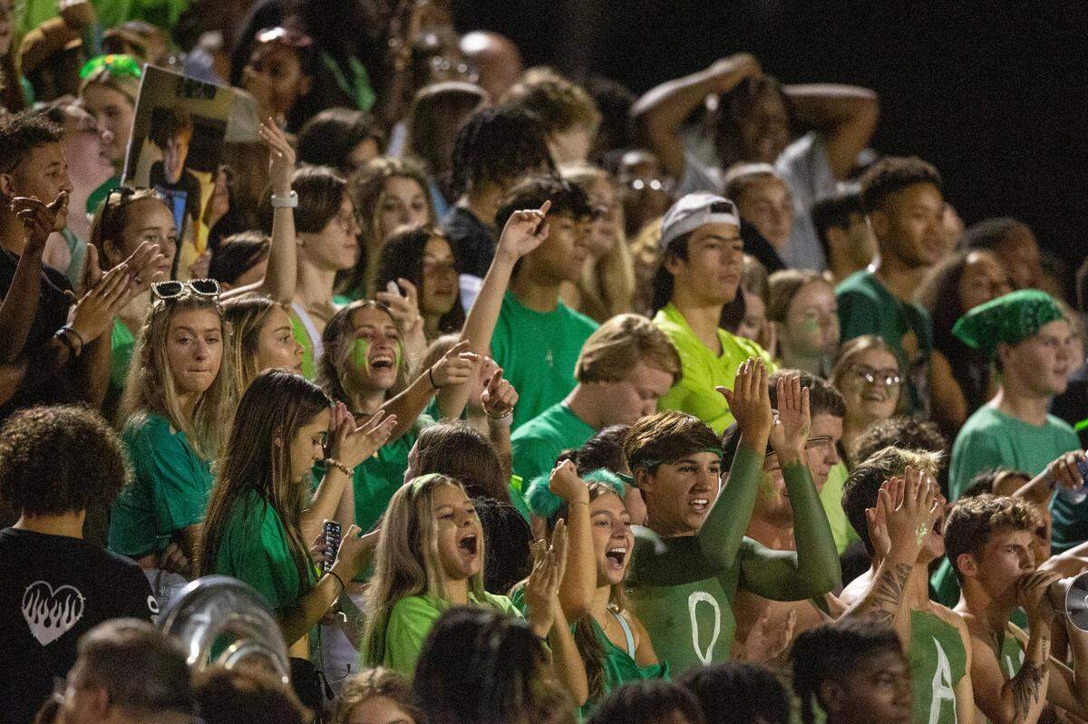 D’Iberville fans cheer for their team during a game against Biloxi at Warriors Stadium in D’Iberville on Friday, Sept. 23, 2022.