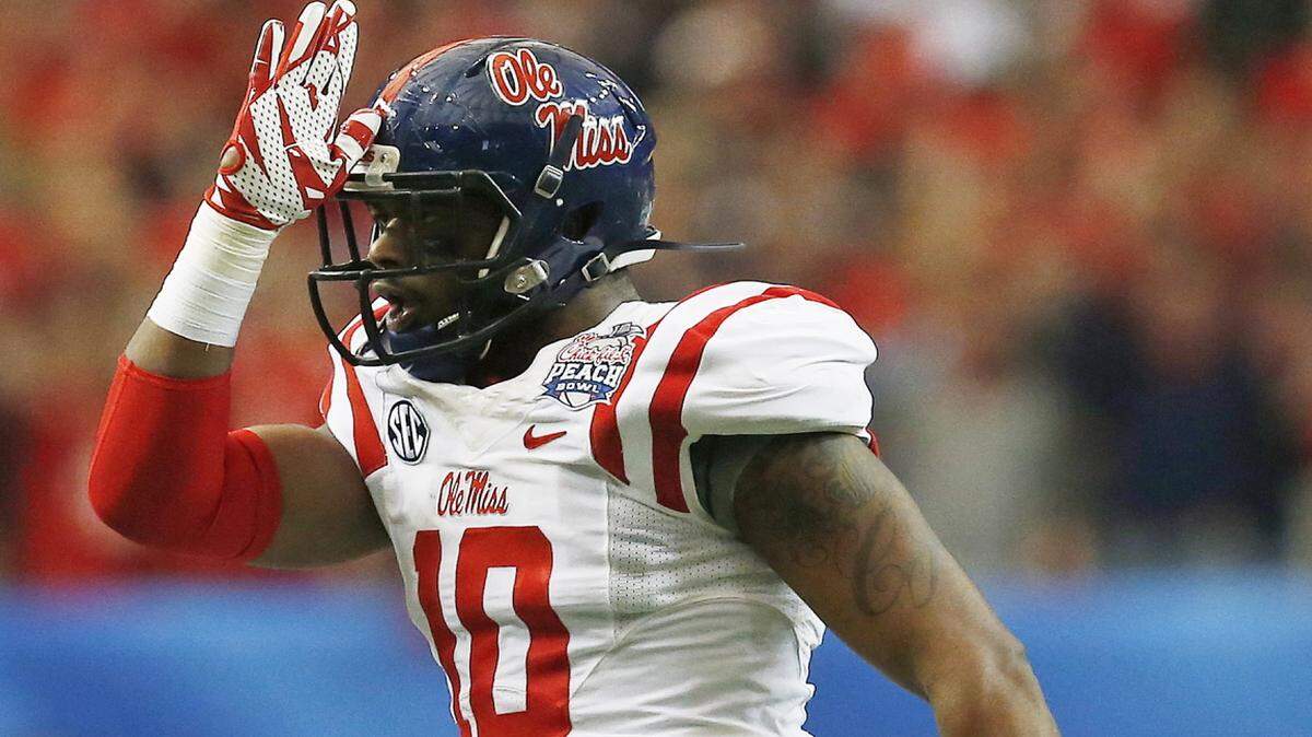 Mississippi defensive end C.J. Johnson (10) displays the land shark symbol after a play against TCU during the first half of the Peach Bowl NCAA football game, Wednesday, Dec. 31, 2014, in Atlanta. (AP Photo/Mike Stewart)