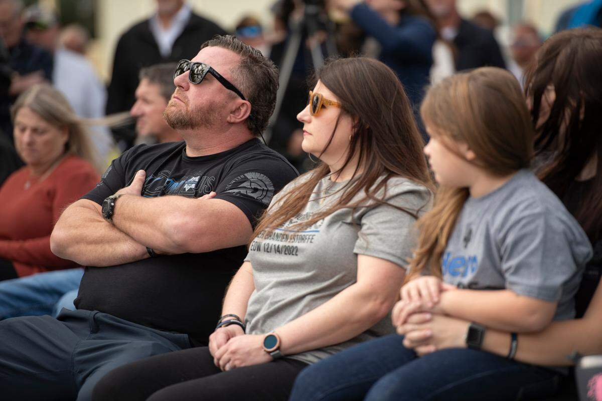 Members of Branden Estorffe’s family during a ceremony dedicating commemorative stars in honor of Sergeant Steven Robin and Officer Branden Estorffe outside the new Bay St. Louis Police Department in Bay St. Louis on Thursday, Dec. 14, 2023.