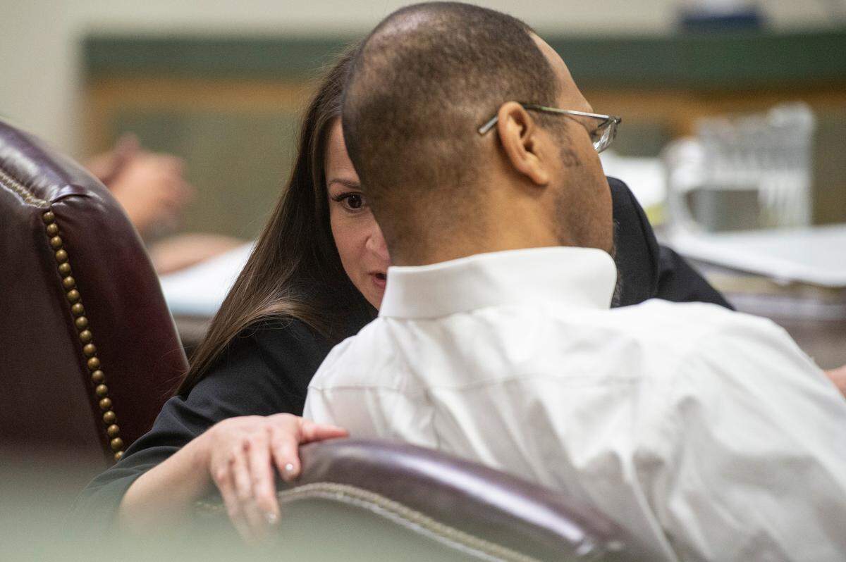 Adrianne Crawford Rhoads talks to her client Dion Neal’s during his trial for sexual battery at the Jackson County Courthouse in Pascagoula on Tuesday, Oct. 11, 2022.