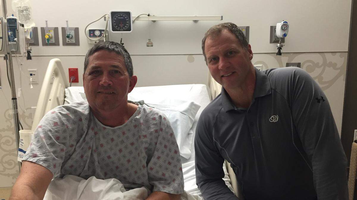 PHOTO COURTESY OF MARK HEADRICK Gulfport firefighter Mark Headrick, 61, suffered serious injuries in an accident Saturday at the fire station on 41st Street. Headrick is pictured here with Gulfport Fire Chief Mike Beyerstedt, right, in his room at LSU Medical Center in New Orleans on Sunday.