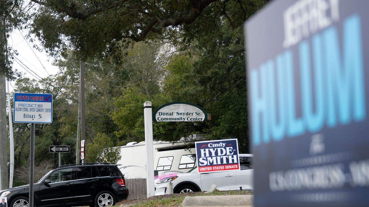 Signs for Jeffery Hulum III and Cindy Hyde-Smith stand next to sings for the Donal Snyder Community Center in Biloxi on Tuesday, March 10, 2026.