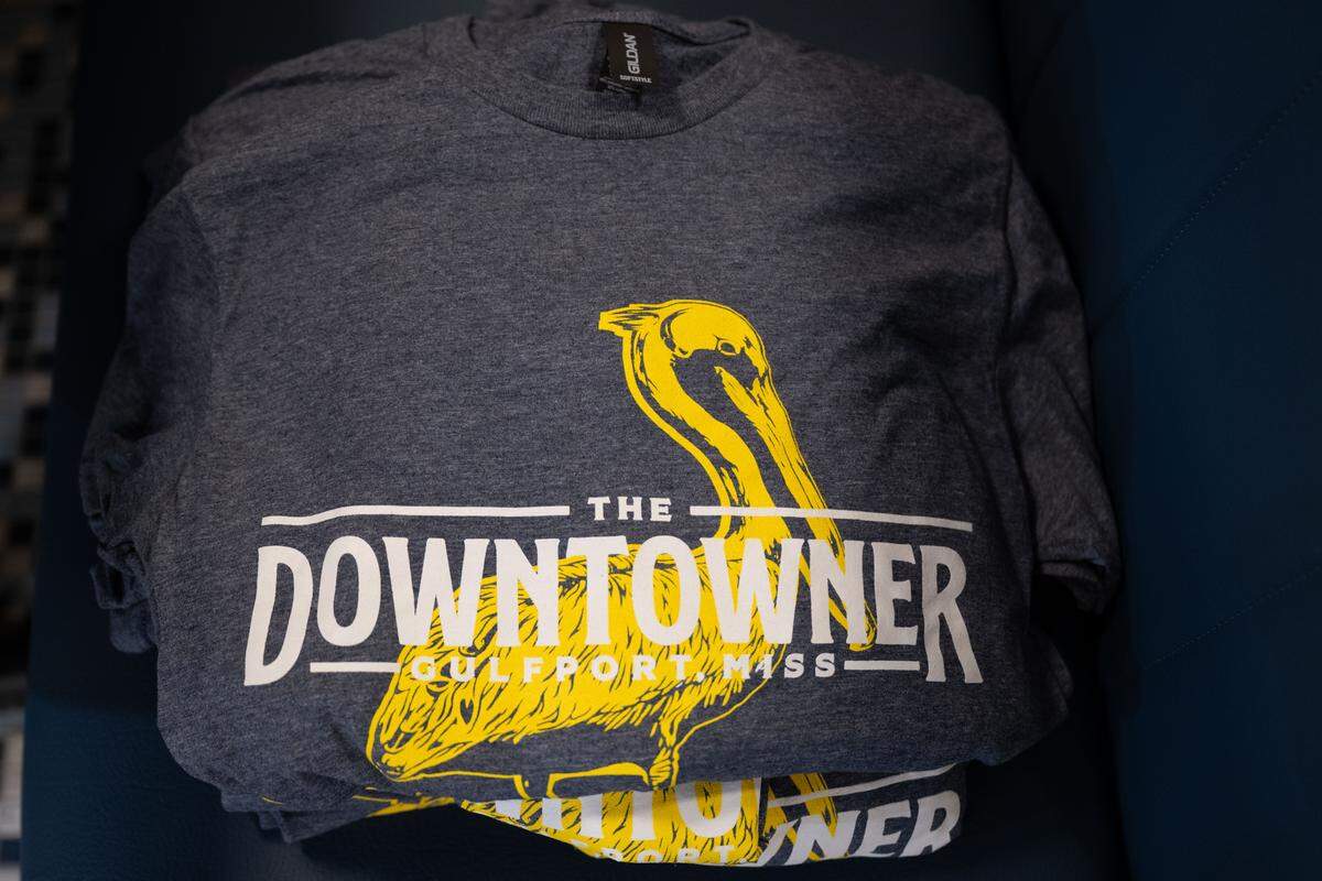 Staff logo shirts for The Downtowner in Gulfport feature a pelican to give a Coast vibe.