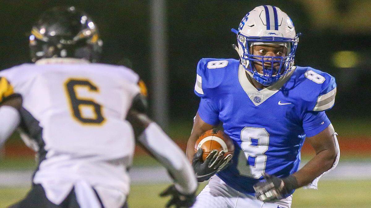 Ocean Springs junior running back David Humphries watches for D’Iberville defenders as he runs the ball against the Warriors Friday, Oct. 2, 2020. The Greyhounds fell to the Warriors at home 27-24.