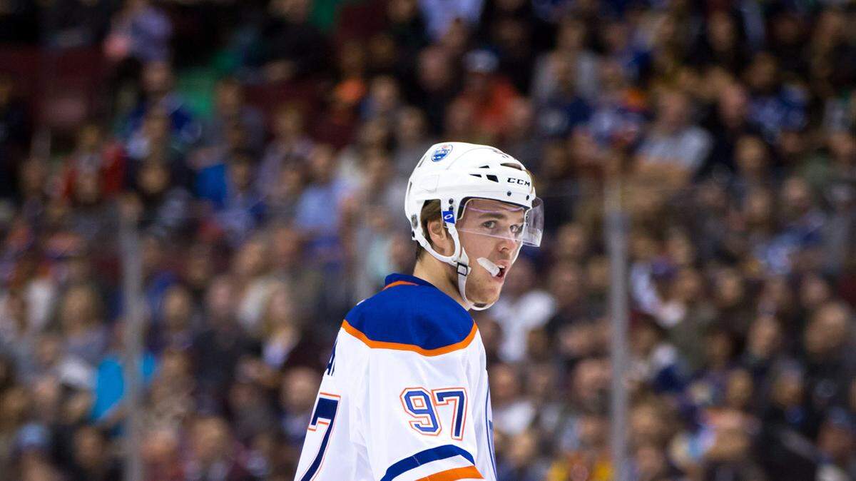 Edmonton Oilers' Connor McDavid skates during a break in play during the first period of a preseason NHL hockey game against Vancouver Canucks in Vancouver, British Columbia, Saturday, Oct. 3, 2015. (Darryl Dyck/The Canadian Press via AP) MANDATORY CREDIT