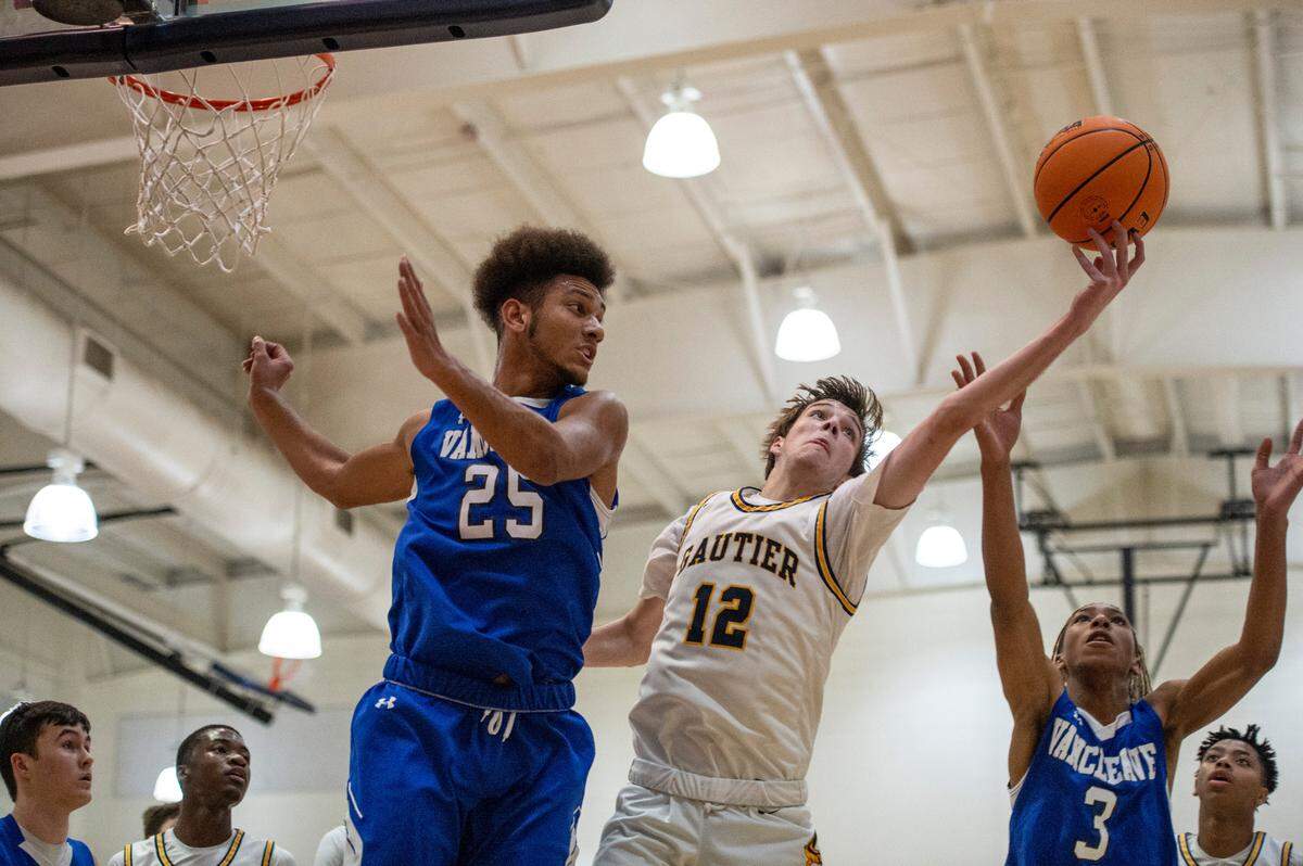 Vancleave forward Oscar Hampton, left, watches as Gautier’s Quincy Roberts gets the rebound during a game against Gautier at Gautier High School in Gautier on Friday, Jan. 21, 2022.