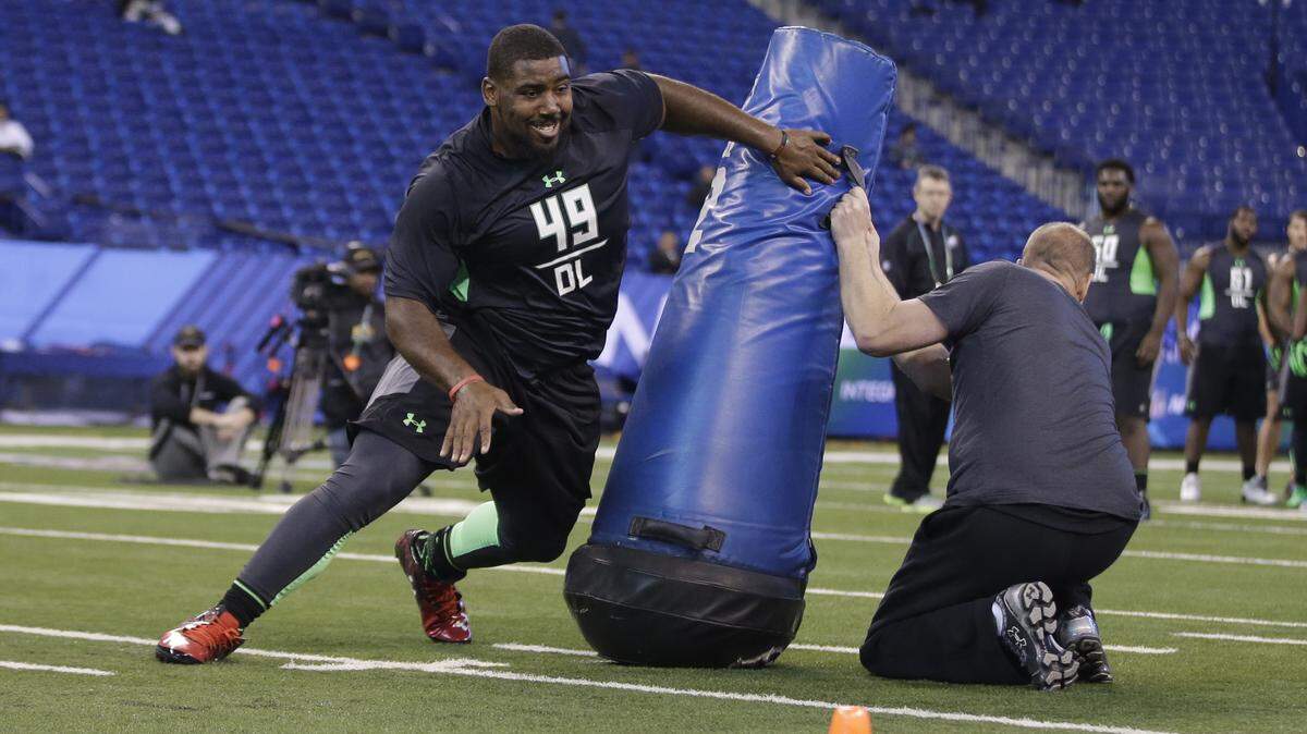 Louisville defensive lineman Sheldon Rankins runs a drill at the NFL football scouting combine on Tuesday, March 1, 2016, in Indianapolis. (AP Photo/Darron Cummings)