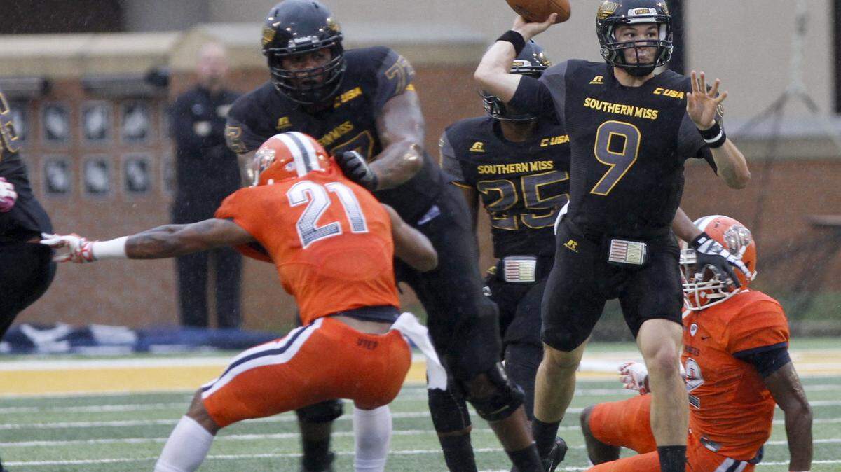 TIM ISBELL/SUN HERALD 
 Southern Miss quarterback Nick Mullens tosses the ball downfield against UTEP, Saturday, Oct. 31, 2015.