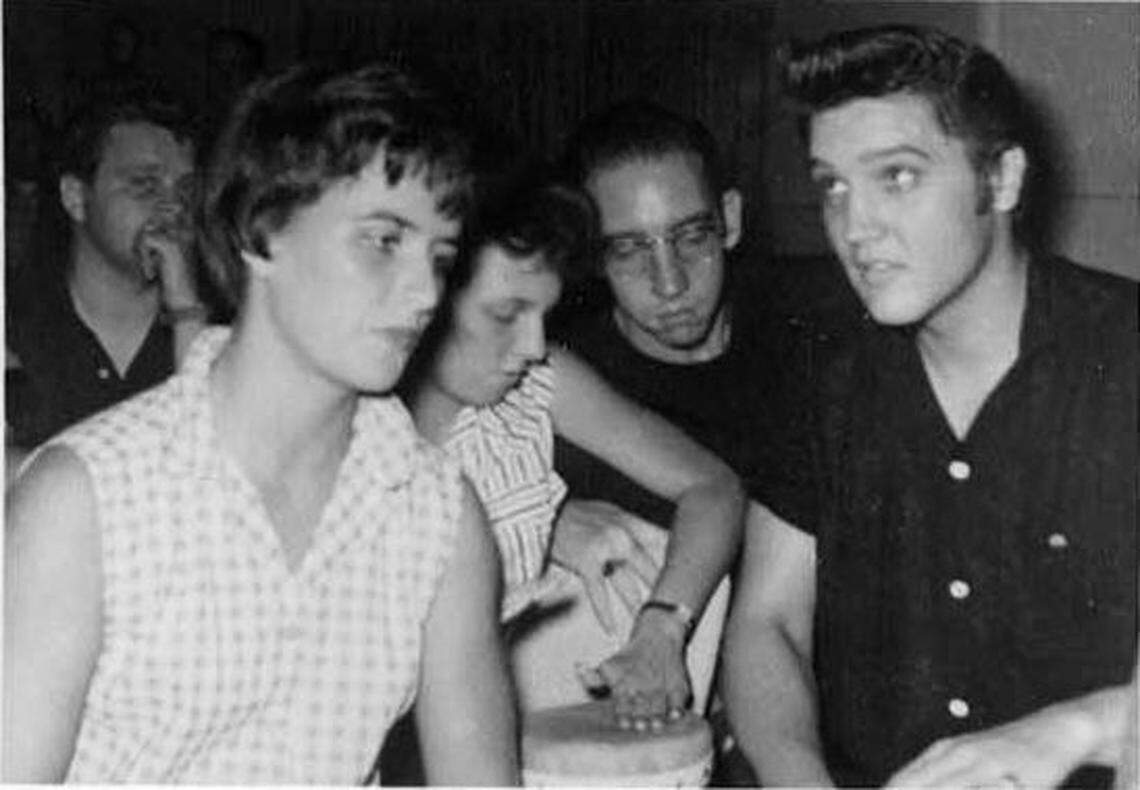 Elvis Presley sits with June Juanico at the Pink Pony club in Gulf Hills in Ocean Springs in August of 1956.