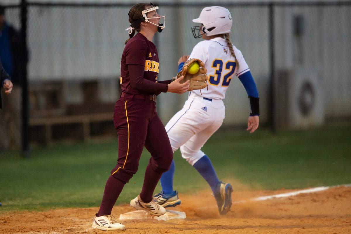 George County’s Natalie Jones catches a ball at third base during a game at St. Martin on Monday, March 20, 2023.