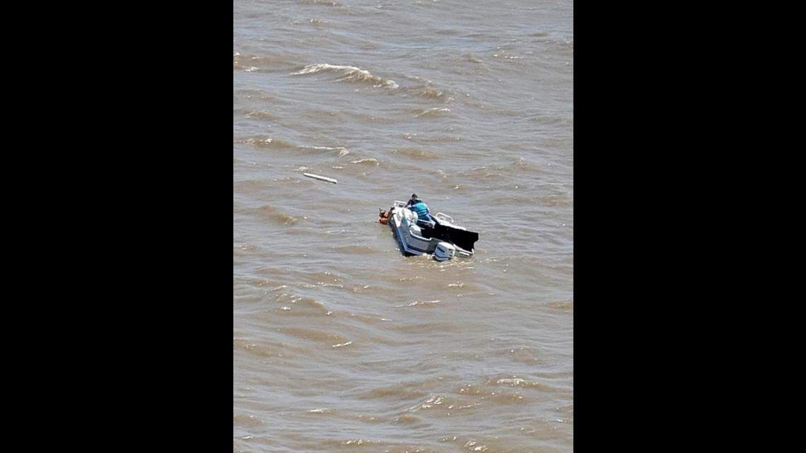 Two men had to be rescued after a good Samaritan spotted their sinking boat near Lake Pontchartrain, according to the U.S. Coast Guard in New Orleans.